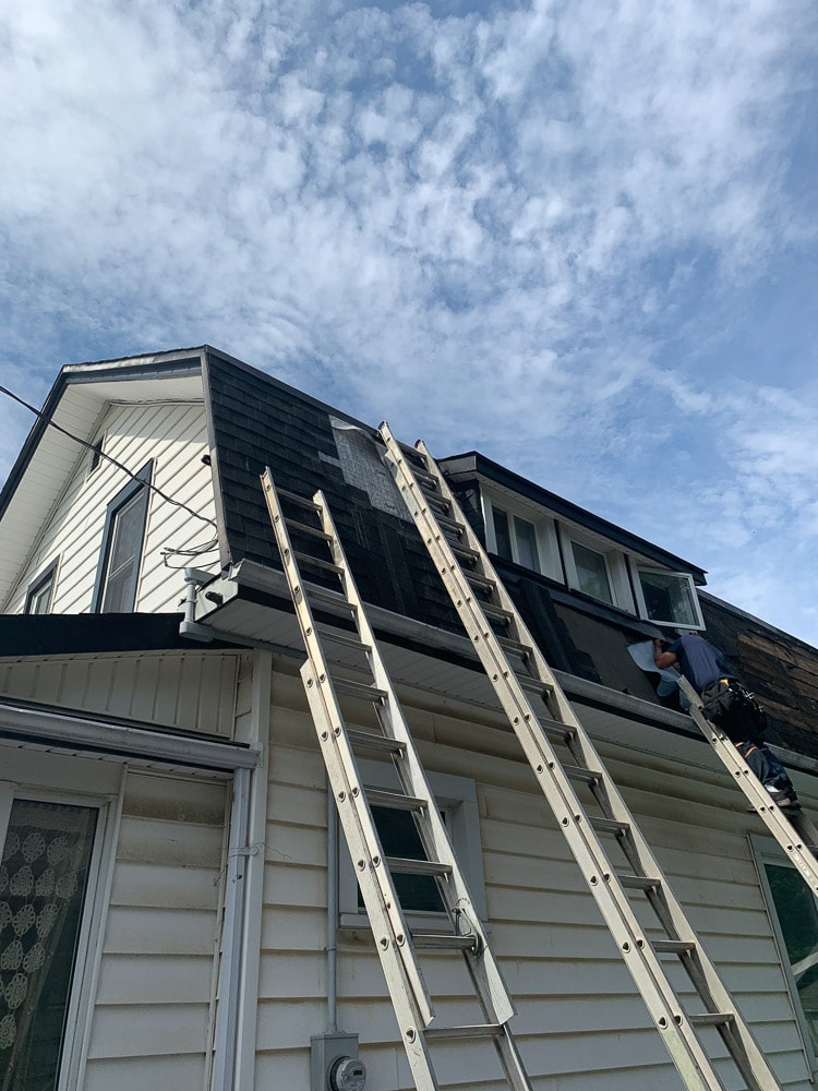 ladders leaning on house