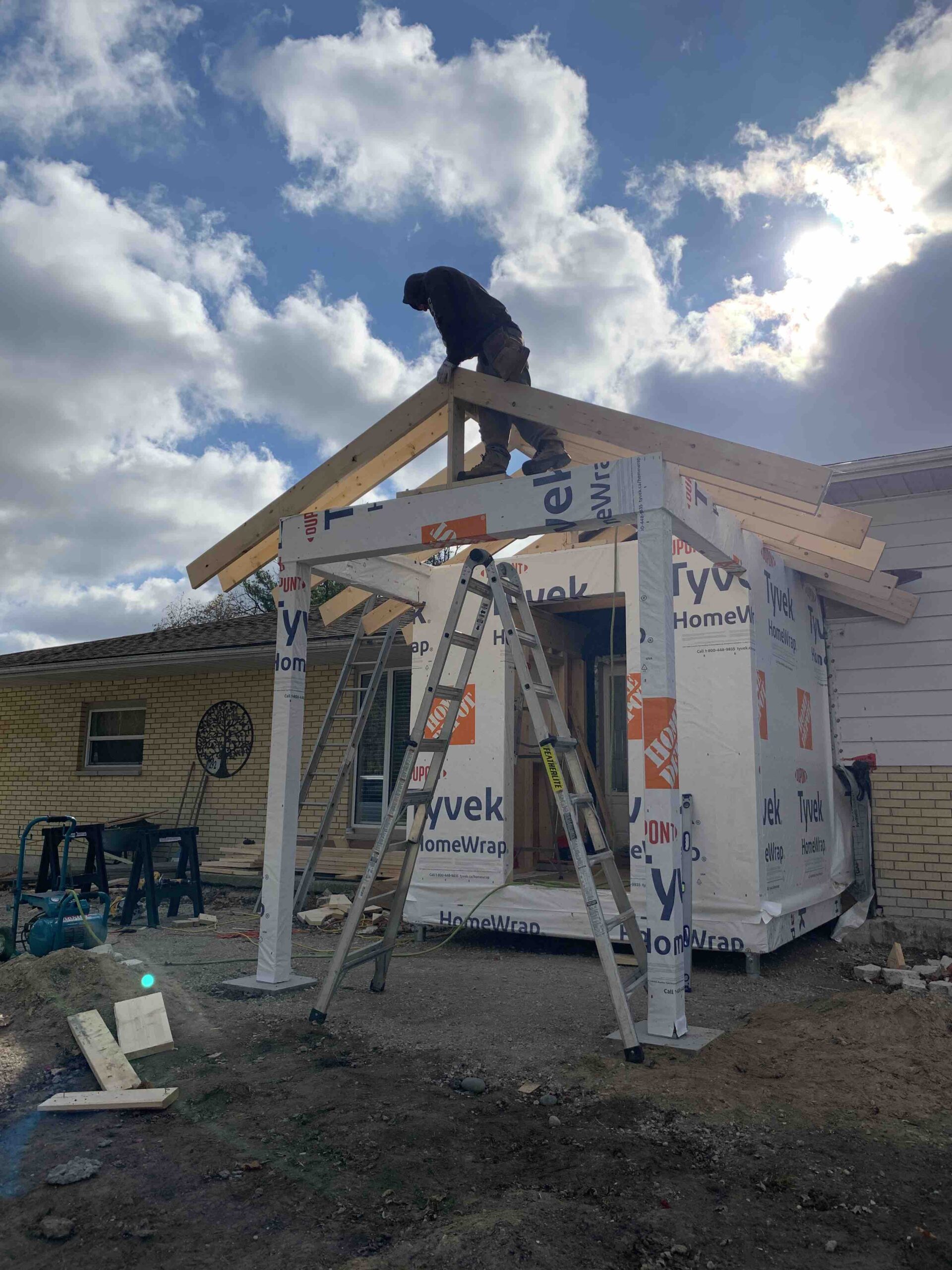 Worker building a dormer on a house