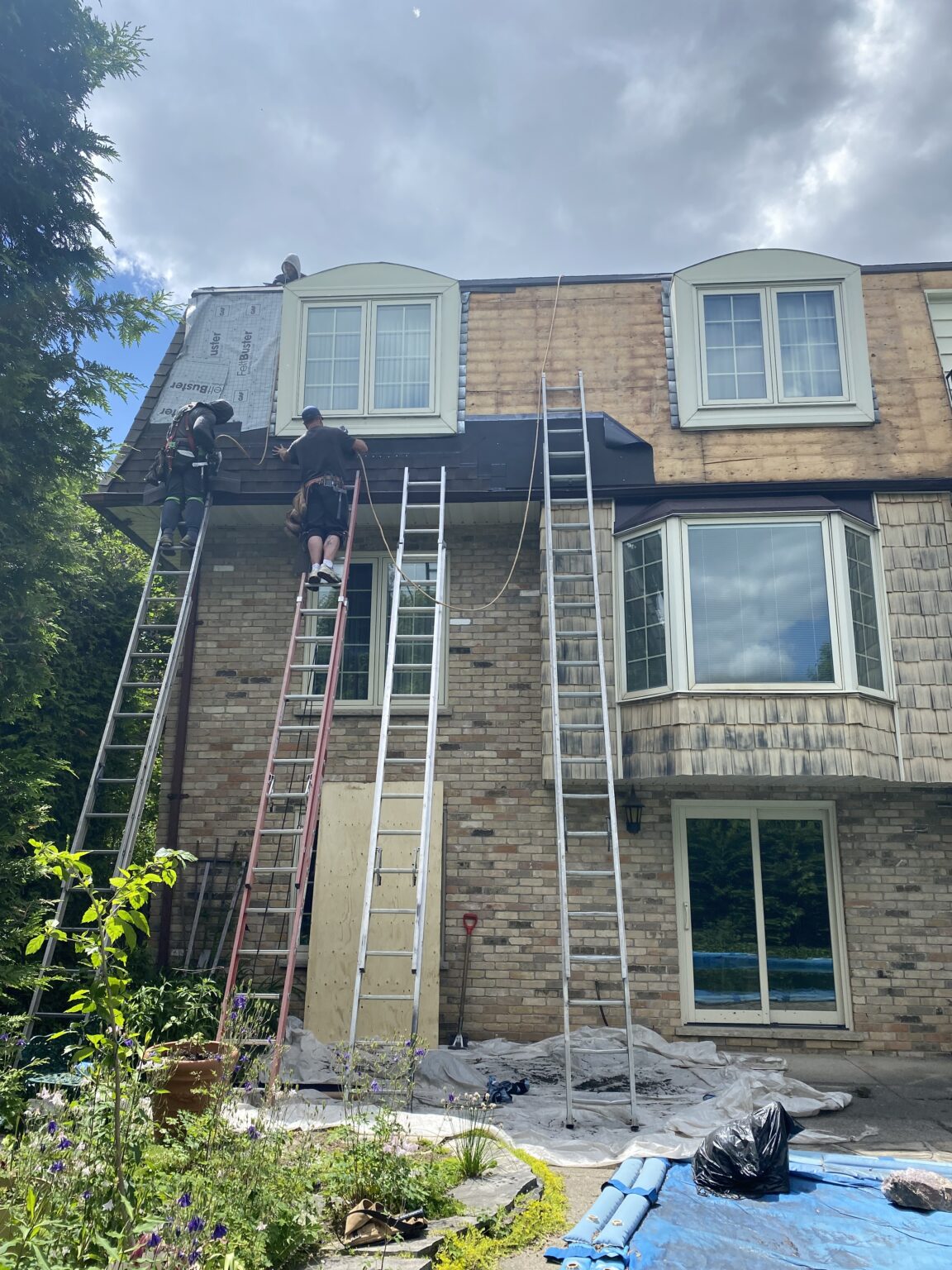 workers installing siding